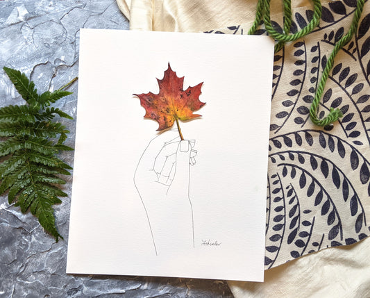 ink drawn hand with 3-d watercolor fall leaf